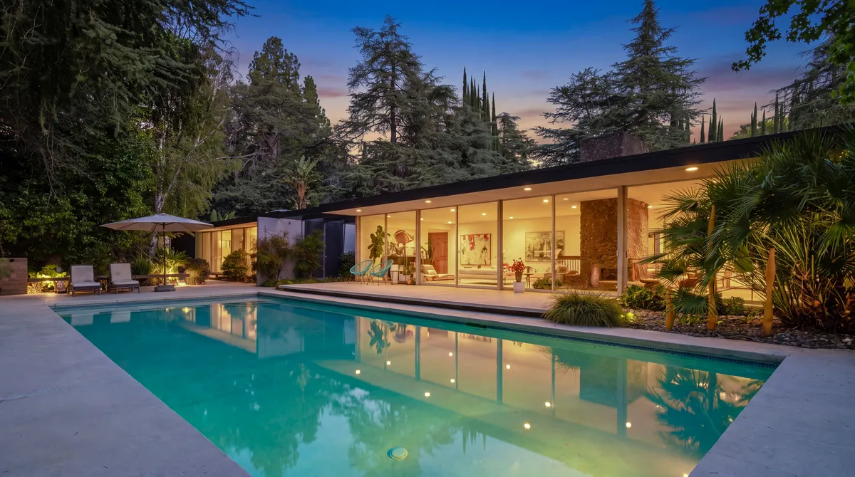 Los Angeles home with a pool at dusk