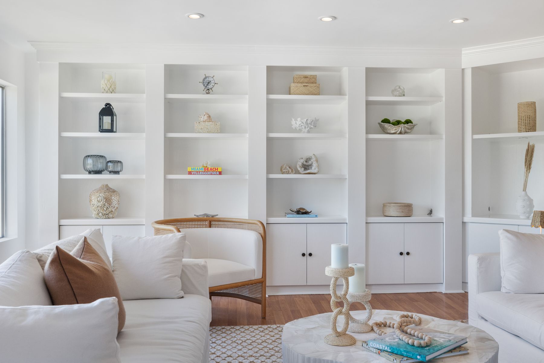 Built-in display shelves and a light-filled living room.
